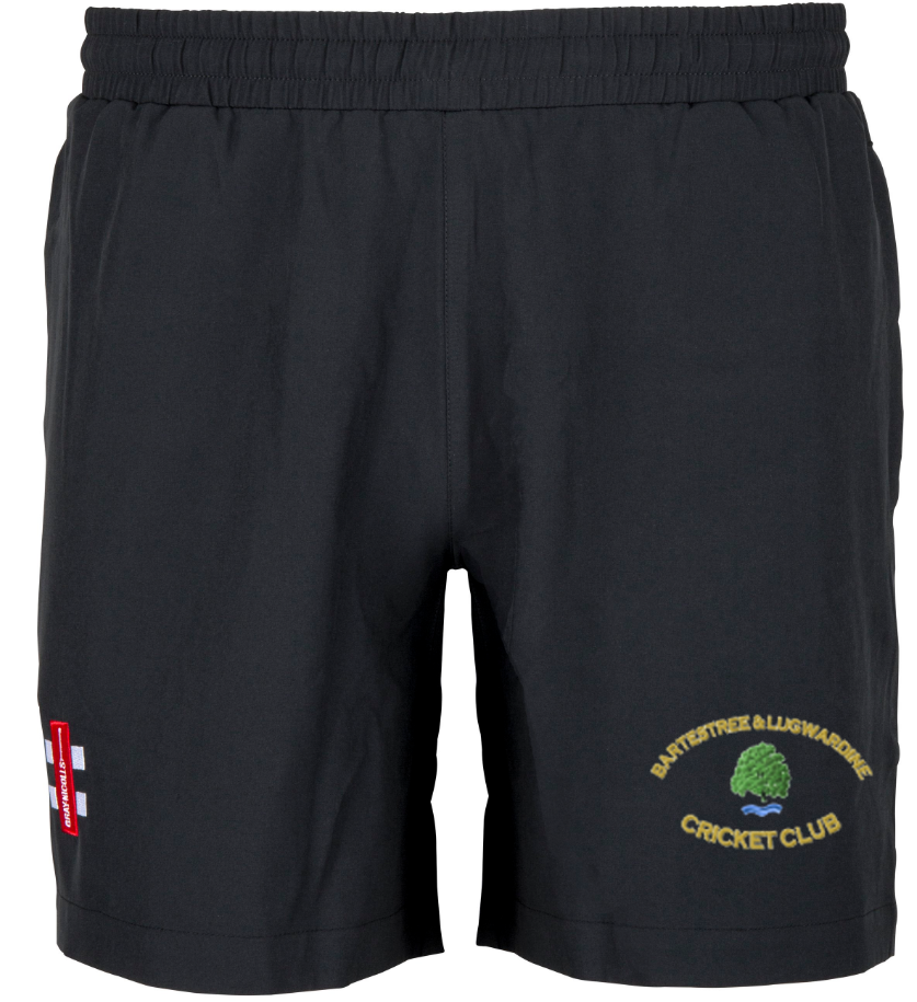 Gray Nicolls Bartestree & Lugwardine CC Velocity Shorts feature an elastic waistband, a green and yellow tree logo on the right leg, and a red and white shield on the left—ideal for your cricket training sessions.