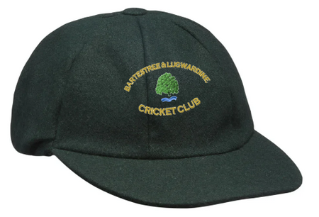 The Bartestree & Lugwardine CC Traditional Cap by Hunts County is a dark green cricket cap with the club’s embroidered yellow logo featuring BARTESTREE & LUGWARDINE CRICKET CLUB, a green tree, and blue water—ideal for all players and supporters.