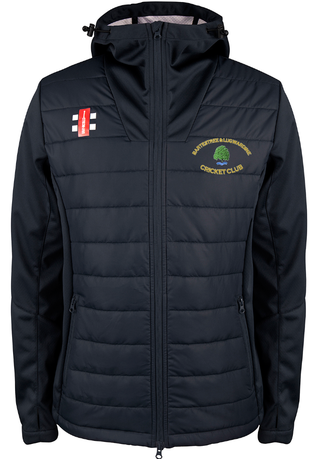 The Bartestree & Lugwardine CC Pro Performance Jacket by Gray Nicolls is a black zip jacket with a quilted front, zip closure, pockets, a green and yellow logo on the left chest, and a small white and red emblem on the right.