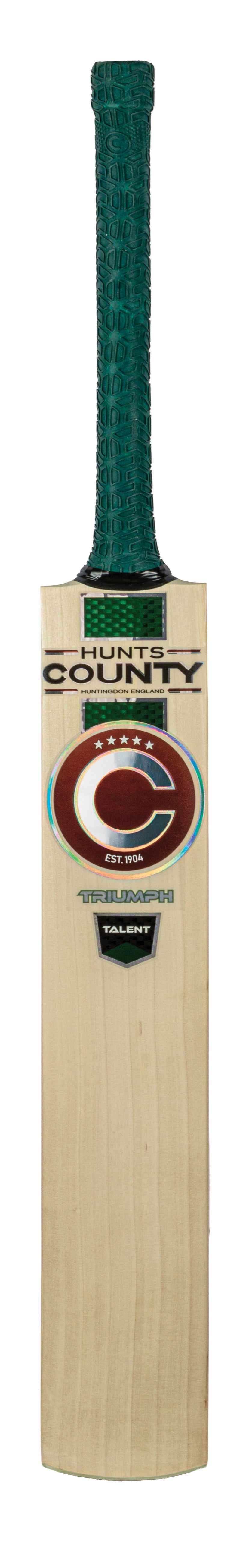 Introducing the Hunts County Triumph Talent Junior Cricket Bat, expertly crafted from high-quality English Willow. This bat features a durable wooden blade, a striking green textured grip, and bold front branding that showcases the distinctive ‘C’ logo alongside the word ‘County.’.