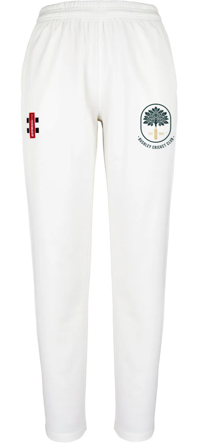 The Bushley CC Matrix V2 Ladies Ivory Trousers by Gray Nicolls feature an elastic waistband and two embroidered badges: a tree logo for Pudsey Cricket Club and a red logo with vertical bars and a cross—ideal for ladies' cricket or Bushley CC teamwear.