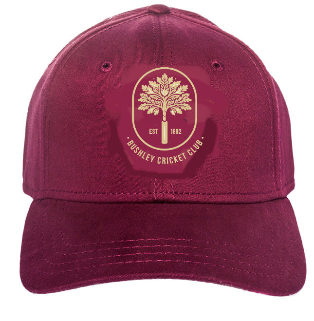 The Bushley CC Ladies Maroon Cricket Cap by Martin Berrill Sports features the club crest—a gold tree, "EST 1892," and club name in gold—on the front. This stylish, one-size cap ensures a comfortable fit for all.