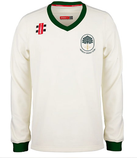 The Gray Nicolls Bushley CC Pro Performance Sweater is a cream, long-sleeved cricket sweater with green trim on the collar and cuffs and features two small right shoulder patches. The Somely Cricket Club logo appears on the left chest.