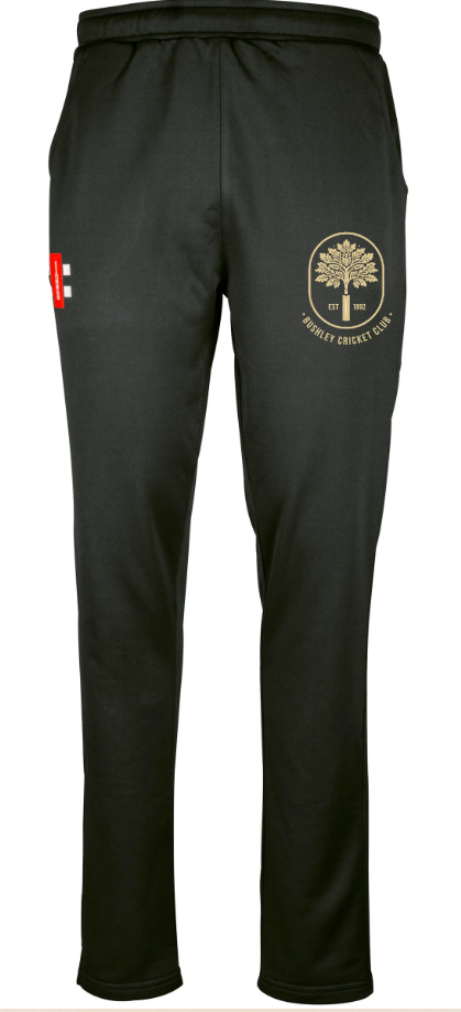 The Gray Nicolls Bushley CC Velocity Track Trouser features an elastic waistband, a gold tree emblem with "Bushley Cricket Club" on the upper left thigh, and a small red logo on the right—ideal athletic fit for training.