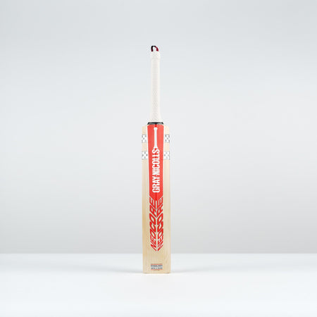 The Gray Nicolls Neocore Pro SH Cricket Bat 2026 stands upright on a plain light gray surface, featuring a Pro Shape with a red and white design, set against a light gray background.