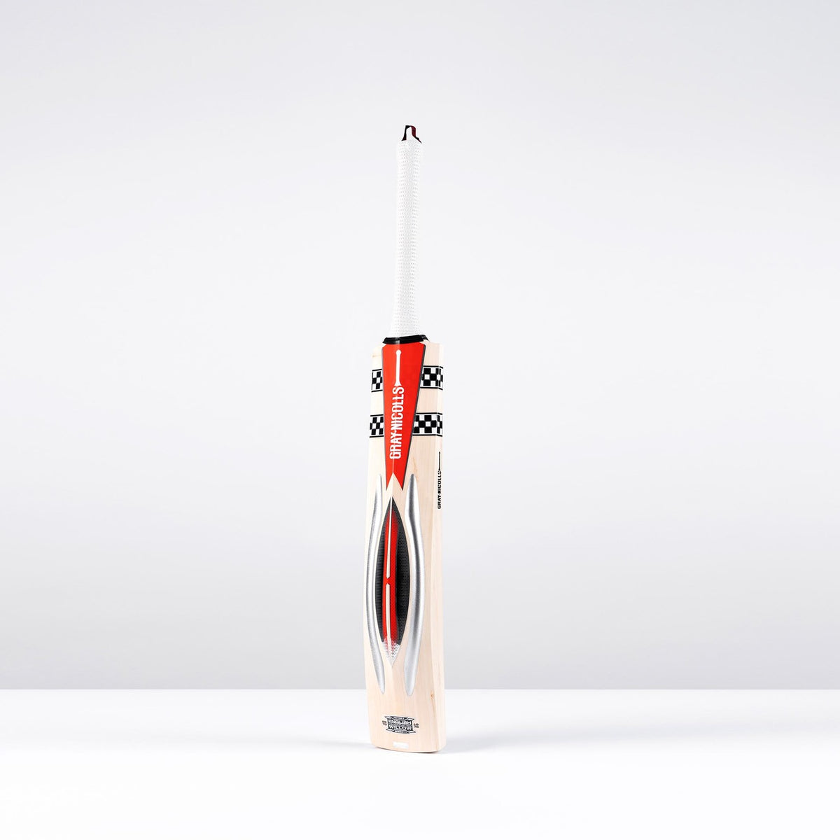 The Gray Nicolls Powerscoop 500 SH Cricket Bat, featuring light wood with red, black, and white graphics, stands upright against a plain light background.