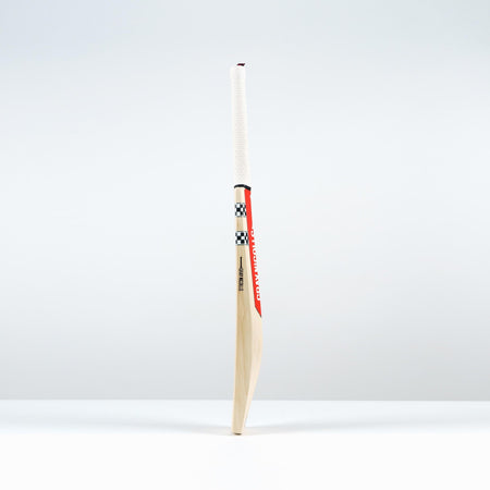 The Gray Nicolls Classic Pro Performance SH Cricket Bat 2026 features a large edge profile, white handle, red and black accents, and a checkered design, standing upright on a white surface against a light background.