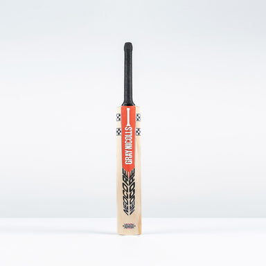 The Gray Nicolls Neocore 500 Harrow Cricket Bat 2026 stands upright with a black handle and red-and-black branding against a plain white background.