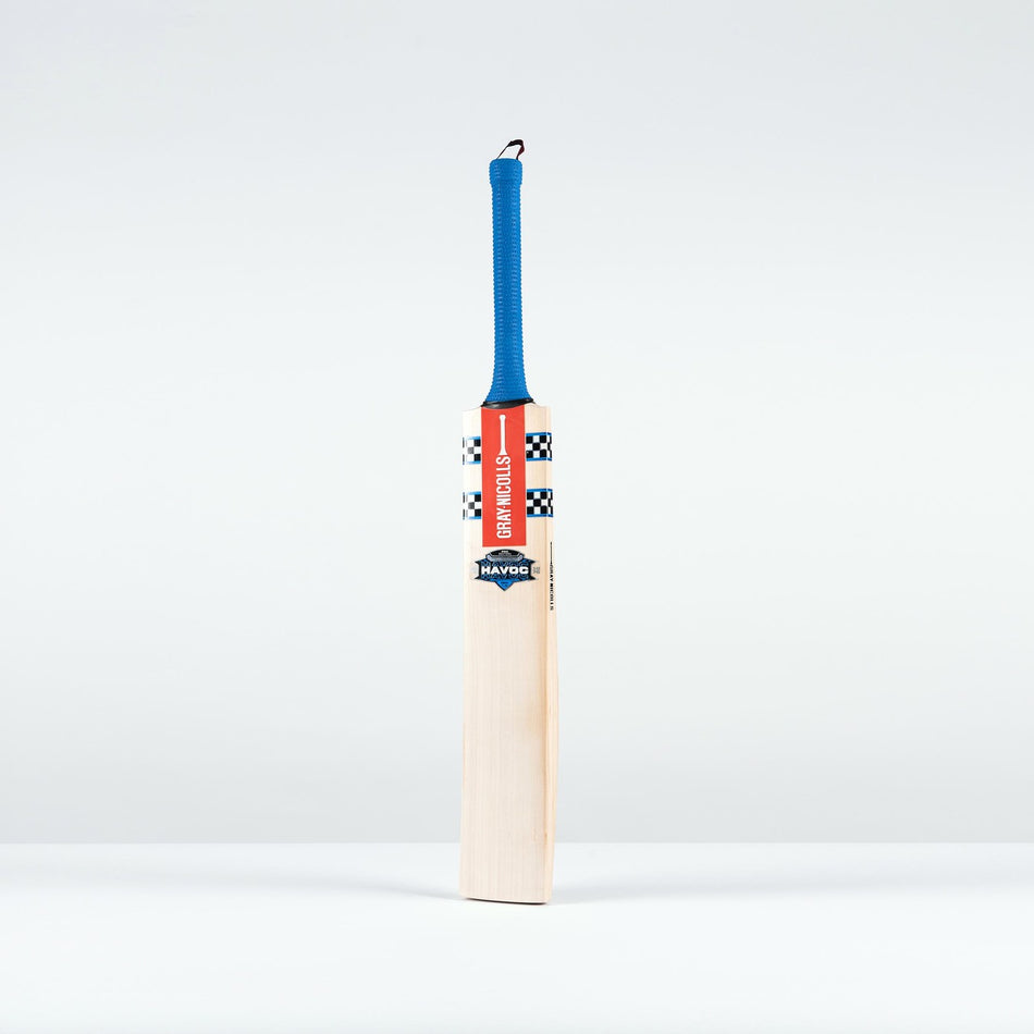 The Gray Nicolls Havoc 1.0 Neocore Players Edition SH 2026 cricket bat, featuring a blue handle, red branding, and checkered black-and-white detailing, stands upright against a white background, built for explosive bat speed.