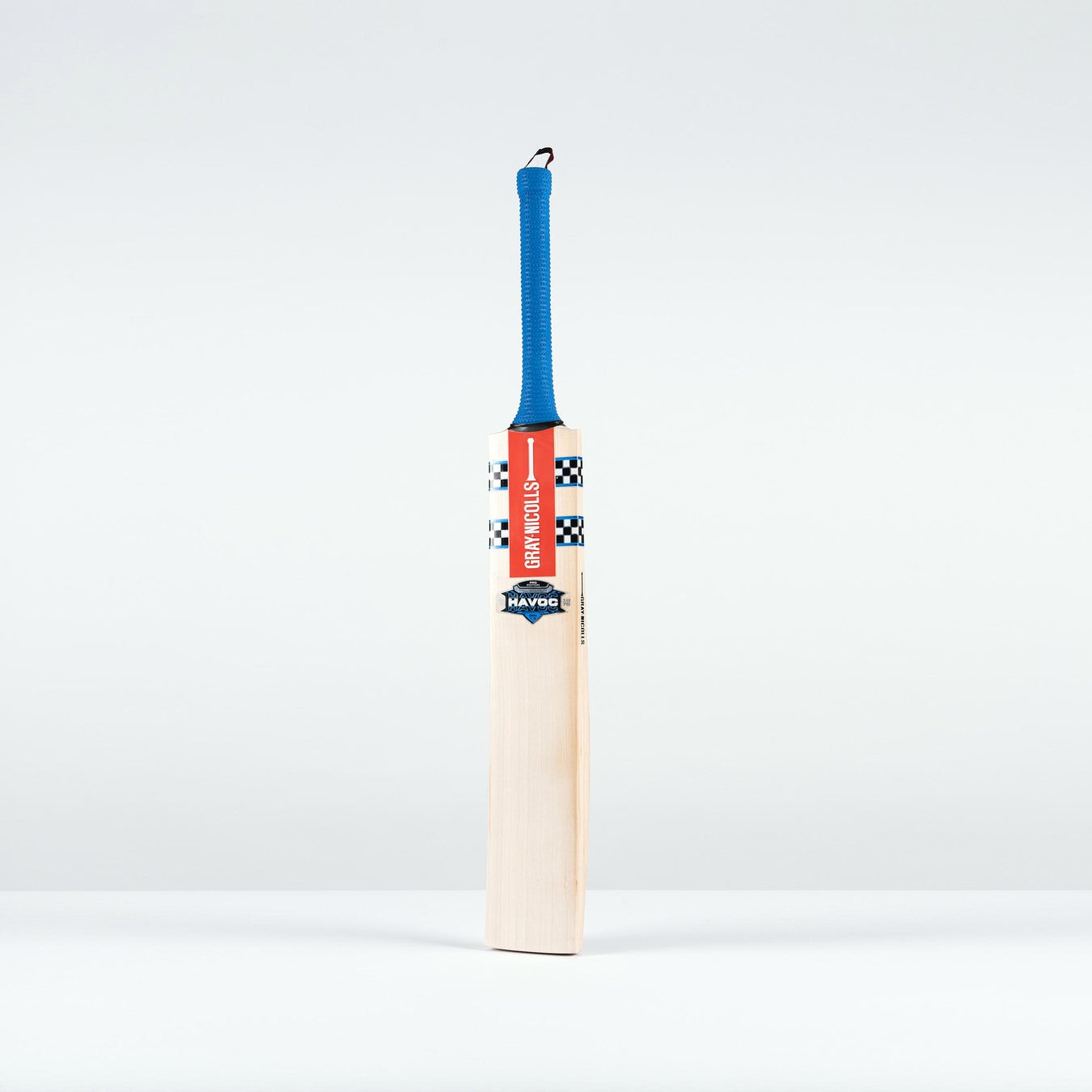 The Gray Nicolls Havoc 1.0 Neocore Players Edition SH 2026 cricket bat, featuring a blue handle, red branding, and checkered black-and-white detailing, stands upright against a white background, built for explosive bat speed.