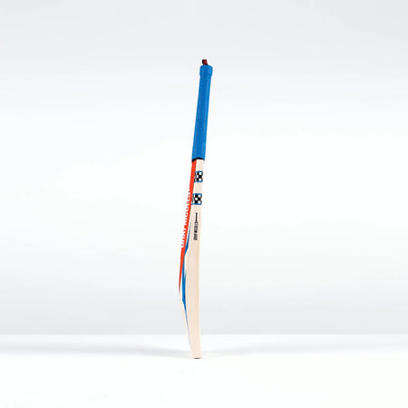 The Gray Nicolls Havoc 1.0 Test Cricket Bat 2026, featuring a blue grip and red-blue accents, stands upright against a plain white background.