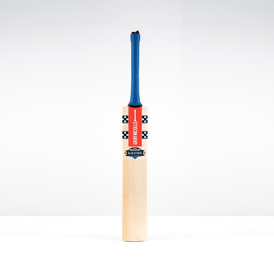 The Gray Nicolls Havoc 1.0 Pro Cricket Bat 2026 stands upright on a white background, featuring a blue grip, an orange and black striped label, and "HAVOC" on the front, offering exceptional balance by Gray Nicolls.