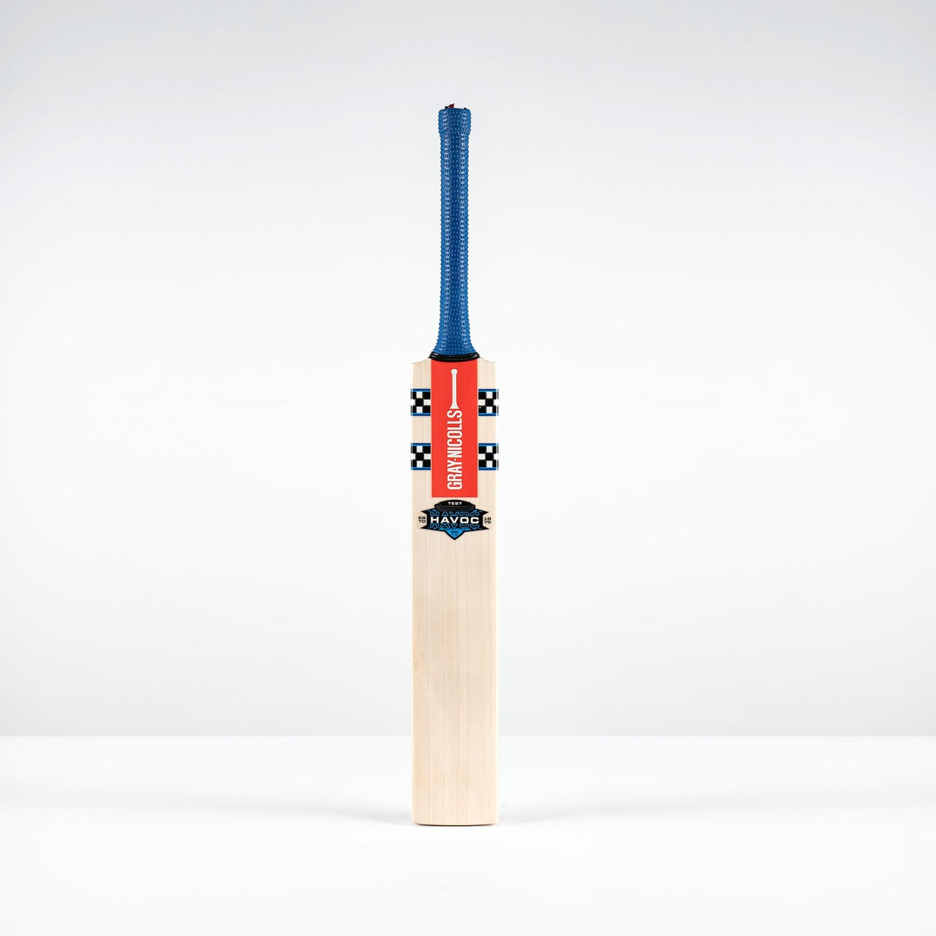 The Gray Nicolls Havoc 1.0 Test Cricket Bat 2026 features a blue grip, red front sticker, mid sweet spot, and stands upright against a plain white background.