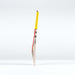 A Gray Nicolls Havoc HB317 Pro Edition SH 2026 cricket bat stands upright on a white surface, showcasing a mid-blade profile, yellow grip, and colorful design near the handle against a plain white background.