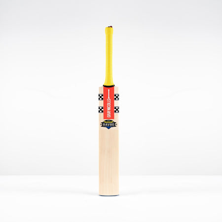 A Gray Nicolls Havoc HB317 Test SH 2026 bat with a yellow handle, red branding, and black-and-white checkered upper blade stands upright against a plain white background.