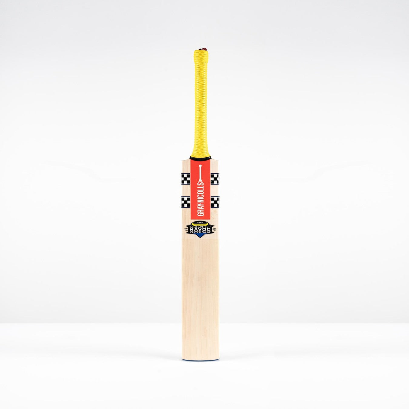 A Gray Nicolls Havoc HB317 Test SH 2026 bat with a yellow handle, red branding, and black-and-white checkered upper blade stands upright against a plain white background.