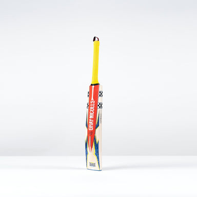 The Gray Nicolls Havoc HB317 GN330+ Junior Cricket Bat 2026 features an ultra-light pickup, yellow handle, and red/blue design. It stands upright on a white surface against a plain white background.