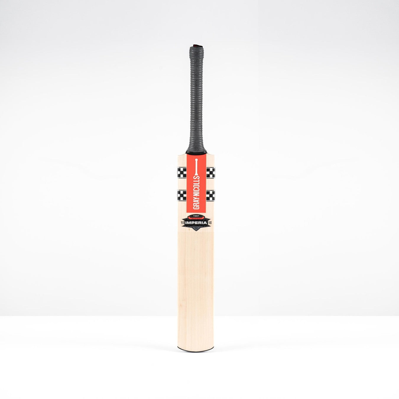 The Gray Nicolls Imperia 1.0 Test Cricket Bat 2026 features a black grip and red checkered label, standing upright against a plain white background.