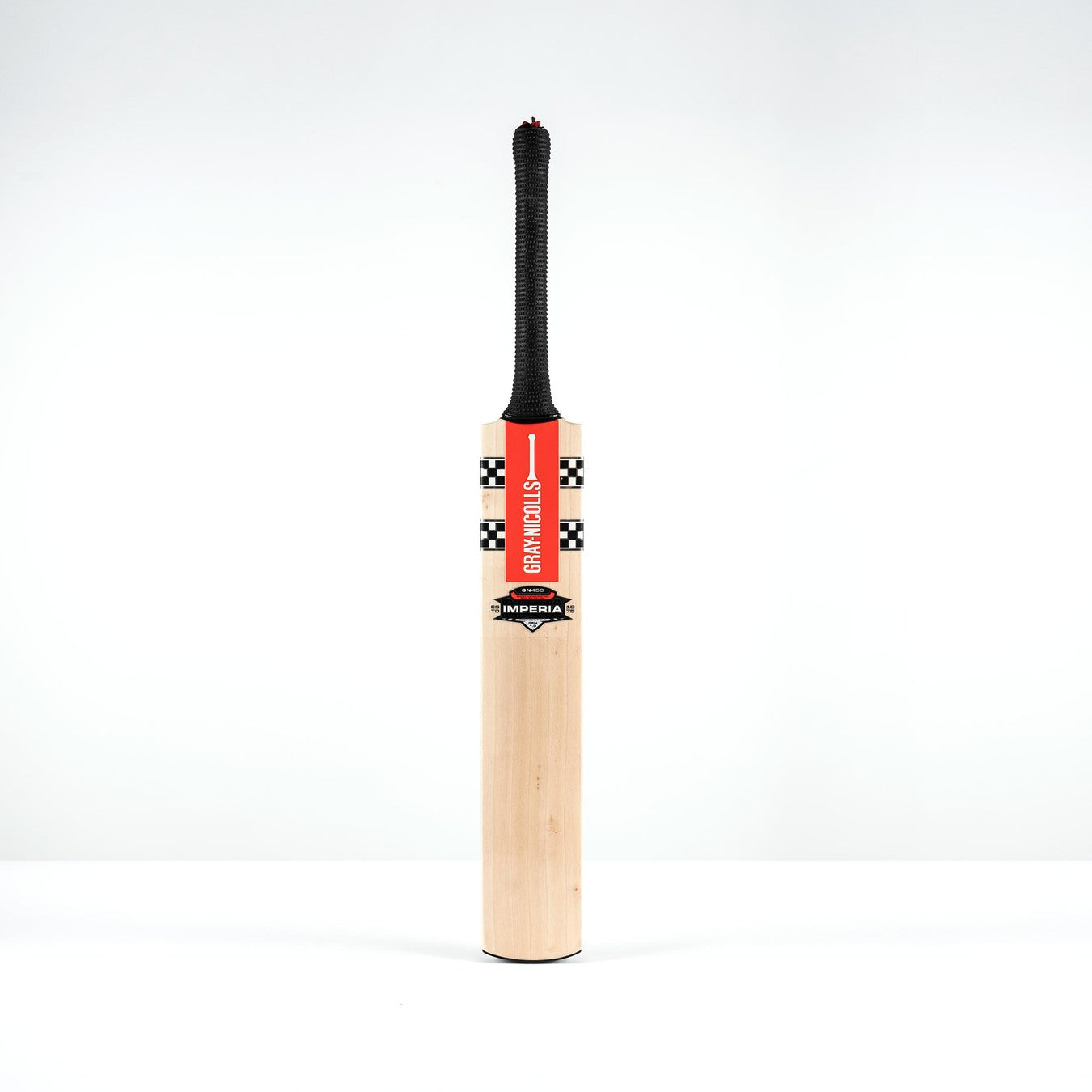 A Gray Nicolls Imperia 1.0 GN450 SH 2026 cricket bat with a black handle and a red STICKY WICKED sticker on the front stands vertically against a white background.