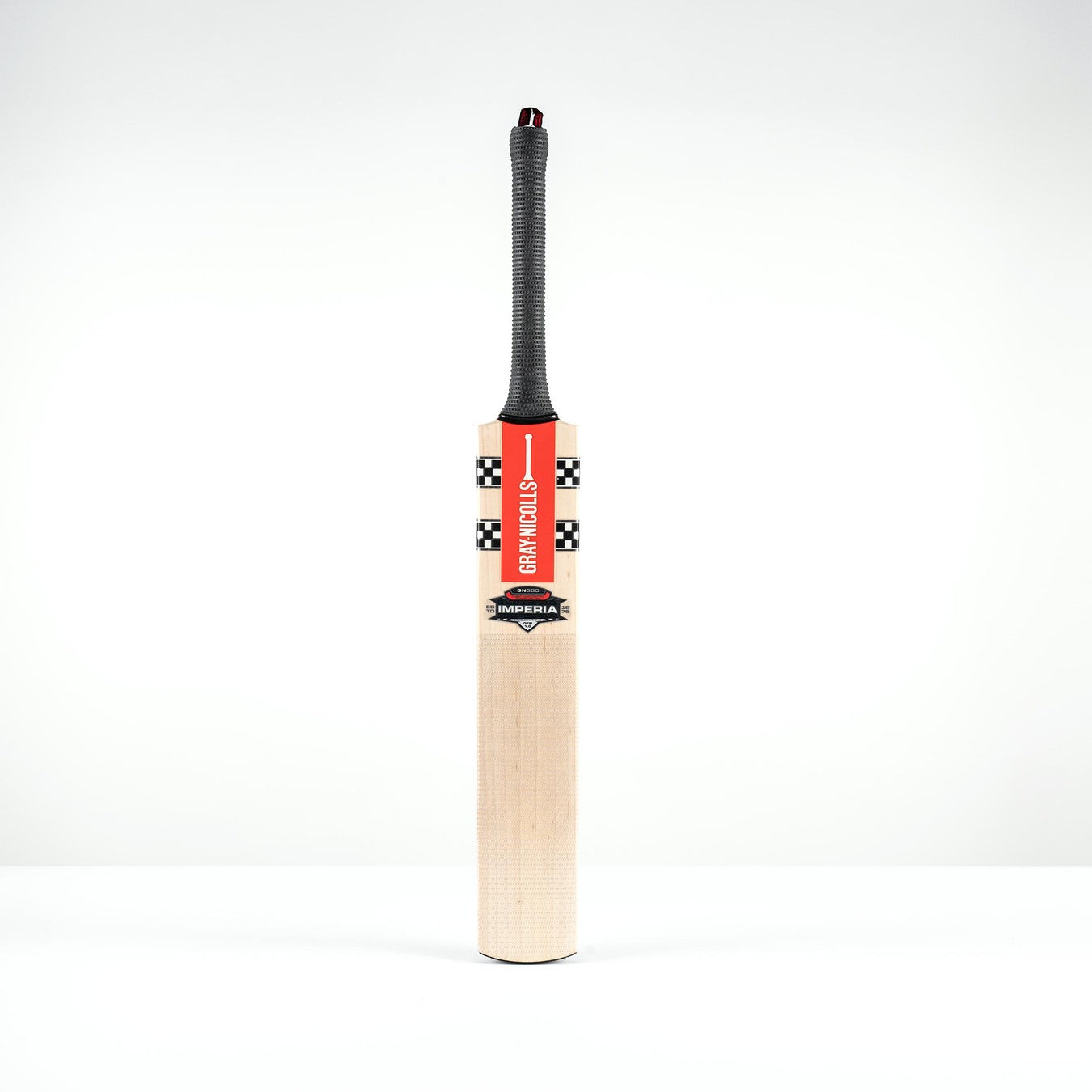 The Gray Nicolls Imperia 1.0 GN350 Junior Cricket Bat 2026, featuring a black handle and red, black, and white decals, stands upright against a plain white background—perfect for young players seeking a low sweet spot.