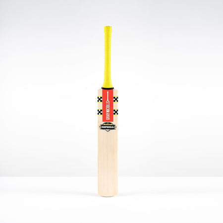 A Gray Nicolls Imperia 1.1 Pro Lite Junior Cricket Bat 2026 with a yellow grip and red label stands upright on a white background, ideal for young cricketers seeking a high-quality Pro Lite bat.