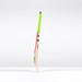The Gray Nicolls Fusion Pro SH 2026 Cricket Bat features a bright green grip and stands upright on a white surface, highlighting its lightweight design and mid-to-low sweet spot against a plain background.