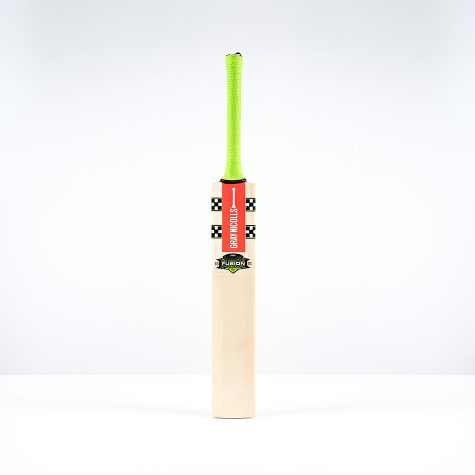 The Gray Nicolls Fusion Pro SH 2026 Cricket Bat with a neon green handle stands upright against a white background, featuring a red and black checkered blade sticker and a mid-to-low sweet spot.