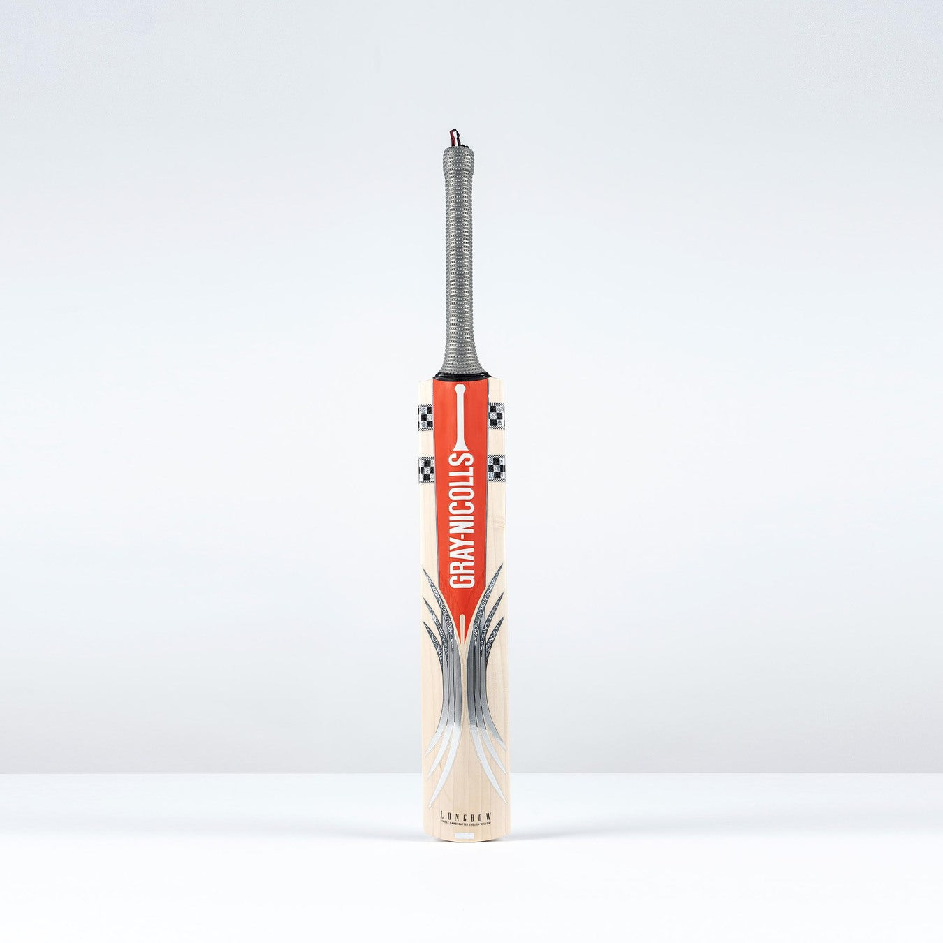 The Gray Nicolls Longbow Pro Junior Cricket Bat 2026 features a mid-to-low sweet spot, gray handle, and bold red branding, standing upright against a plain white background.
