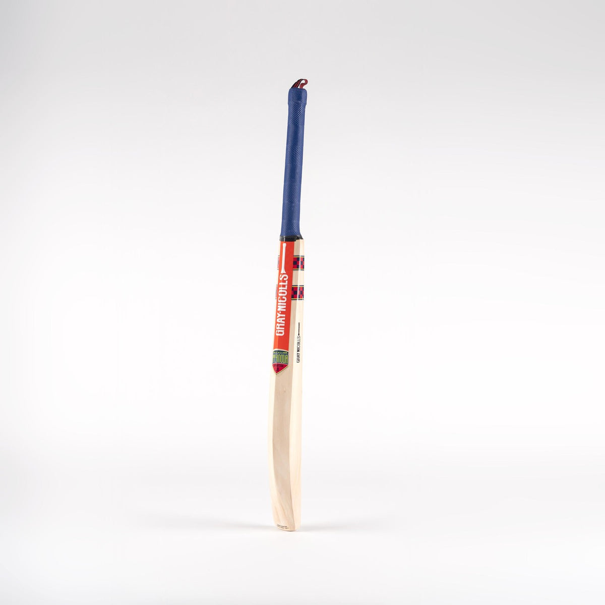 The Gray Nicolls Slimline Technique Cricket Bat, featuring a blue grip, red and white label, and light wooden blade, is shown upright against a plain white background.