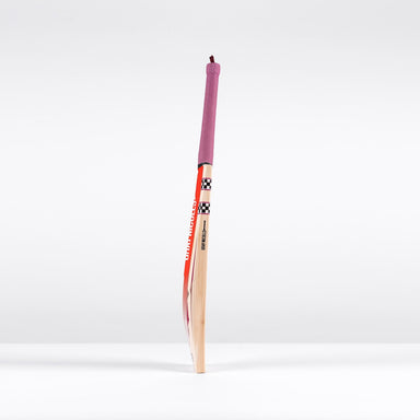 The Gray Nicolls GEM 3.1 Players Edition 2026 Cricket Bat, featuring a red handle grip and colorful design, stands upright against a plain white background, highlighting its lightweight build and elite performance.