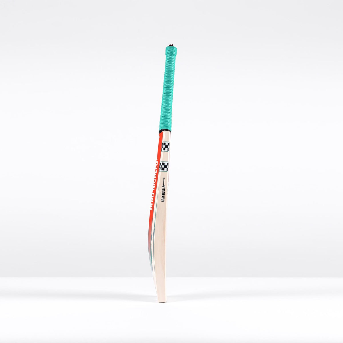 A single Gray Nicolls GEM 3.0 GN550 Cricket Bat 2026 stands upright on a white surface, showing its ultra-light blade, teal grip, and bold black, white, and red accents near the top.