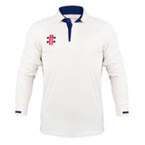 The Gray Nicolls Pro Performance V3 Long Sleeve Shirt is a white, slim fit cricket shirt with blue collar and accents, plus a red and black Gray Nicolls logo on the left chest. Shown on a plain white background. Moisture wicking fabric included.