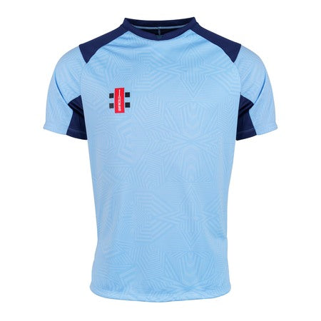 The Gray Nicolls Pro T20 Match Shirts 12 Pack features light blue short-sleeve shirts with dark blue shoulder panels, a subtle geometric front pattern, and a small red, black, and white logo on the left chest.