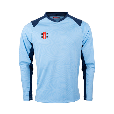 The Gray Nicolls Pro T20 Match Shirts 12 Pack features light blue long sleeves, navy shoulder panels, geometric patterns, and a red and black club logo on the left chest. Displayed on a plain white background.