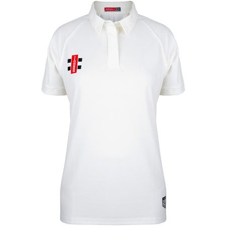 The Bushley CC Ladies Matrix V2 S/S Match Shirt by Gray Nicolls is a white, short-sleeve polo designed for breathability, featuring a classic collar, a small red and black logo on the left chest, and a subtle black label near the bottom hem for added style.