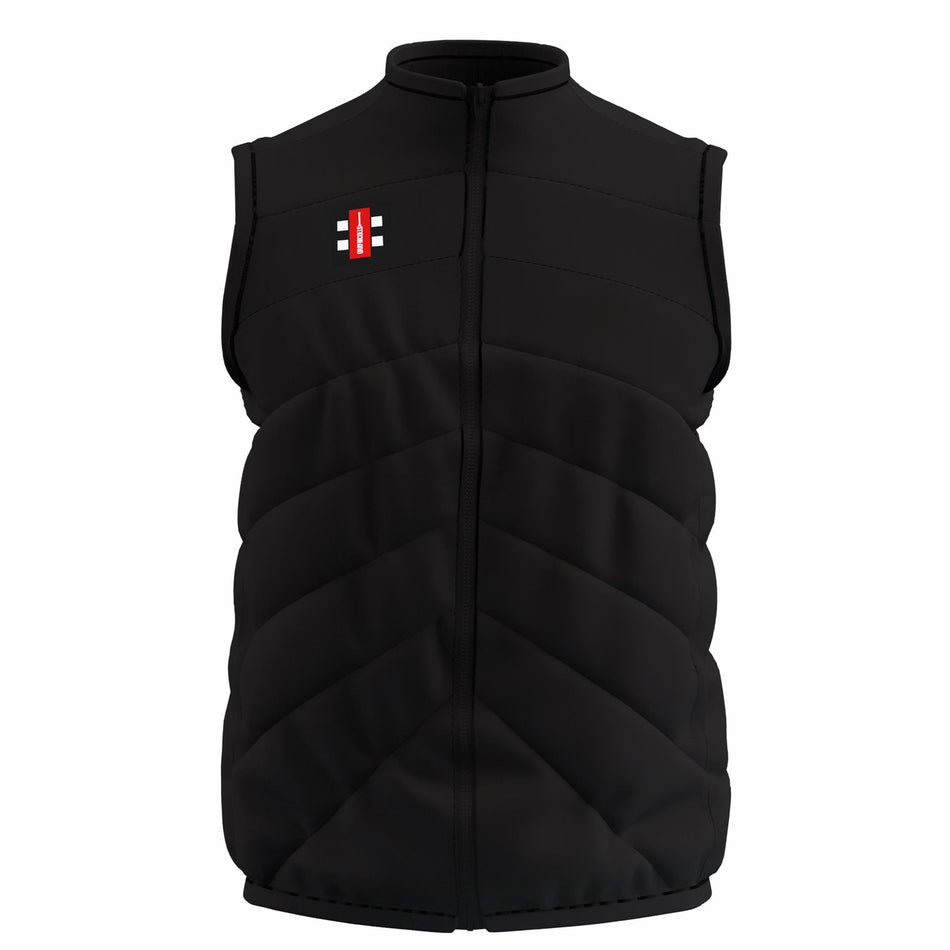 The Gray Nicolls GTS Body Warmer is a black, sleeveless puffer with a front zipper, diagonal quilted stitching, water-repellent finish, and a small rectangular red, white, and black logo on the left chest.
