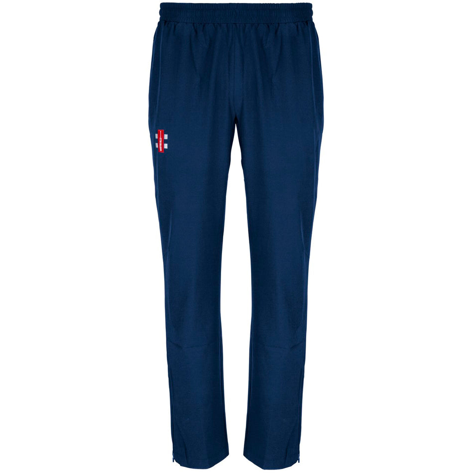 The Gray Nicolls Winchcombe CC Velocity Track Trousers are navy blue with an athletic fit, elastic waistband, and a small red and white logo on the left thigh, perfect for cricket training, shown on a white background.