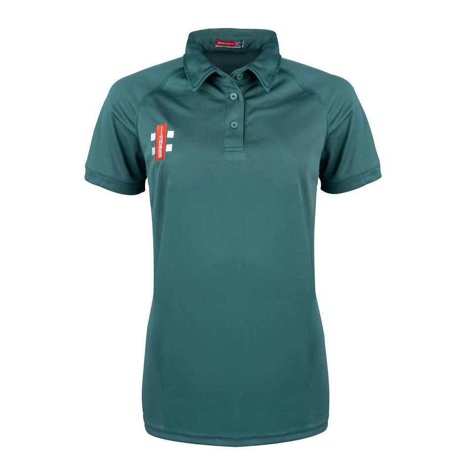 The Gray Nicolls Rockhampton Ravens CC Matrix V2 Ladies Polo Shirt is a short-sleeved, dark green top with a collar, three buttons, and a red and white team logo on the left chest. Displayed against a plain white background.