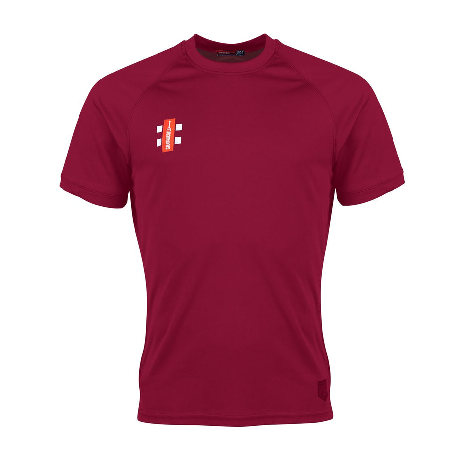 The Gray Nicolls Eastcombe CC Matrix V2 T Shirt is a plain maroon training top with a small white and red logo on the left chest, designed for optimal moisture management. Ideal for Eastcombe CC players. Displayed on a white background.