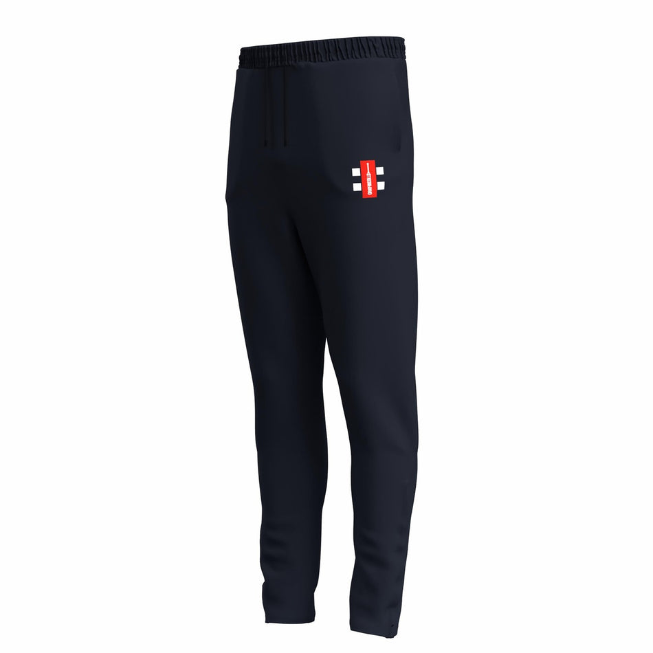 Grays Gray Nicolls GTS Junior Training Trousers in dark navy feature a slim fit, elastic waistband, and a small rectangular red, white, and black logo on the left thigh. Made from performance stretch fabric for comfort. Shown on a white background.