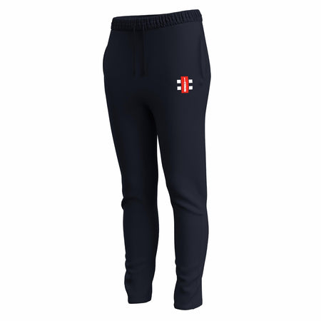 Gray Nicolls GTS Womens Training Trousers in dark navy, featuring a slim fit, elastic waistband with drawstring, performance stretch fabric, and a small rectangular red and white logo with black details on the upper left thigh.