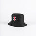 The Gray Nicolls Bucket Hat by Gray Nicolls is black with a red and white rectangular tag on the front, shown against a plain white background.
