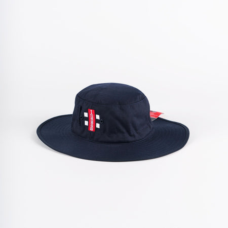 The Gray Nicolls Sun Hat in navy features two small metal eyelets and a red side tag with white text, and is displayed on a plain white background.
