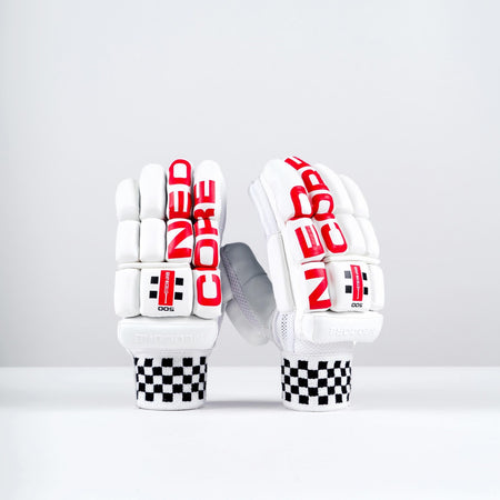 The Gray Nicolls Neocore 500 Batting Gloves 2026 feature a sleek white design with bold red "NEOCORE" branding, split finger construction, black-and-white checkerboard cuffs, and are showcased on a clean, minimal background.
