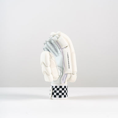 The Gray Nicolls Pro Performance Batting Glove 2026, featuring premium leather and black and white checkerboard wrist detail, is displayed upright against a plain white background.
