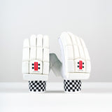 A pair of Gray Nicolls Classic Select Batting Gloves 2026 with black and white checkered wrists, leather palm for grip, and red SELECT logos are displayed upright on a white surface against a plain light background.