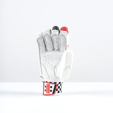 The Gray Nicolls Imperia 1200 Batting Gloves 2026 stand upright with extended fingers, featuring white, gray, black, and red accents plus a red and black checkered wrist strap. Ideal for international players. Plain white background.