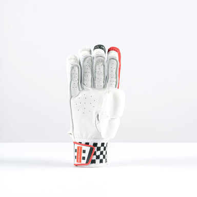 The Gray Nicolls Imperia 1.0 300 Batting Gloves 2026 stand upright on a white surface, palm forward, with black and red accents and the index finger raised in a number one gesture—a classic winner’s sign in club cricket.