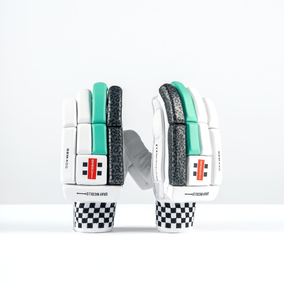 The Gray Nicolls GEM 3.1 400 Batting Gloves 2026 feature black-and-white checkered cuffs, white palms, and teal and black high-density foam padding, standing upright against a plain white background.