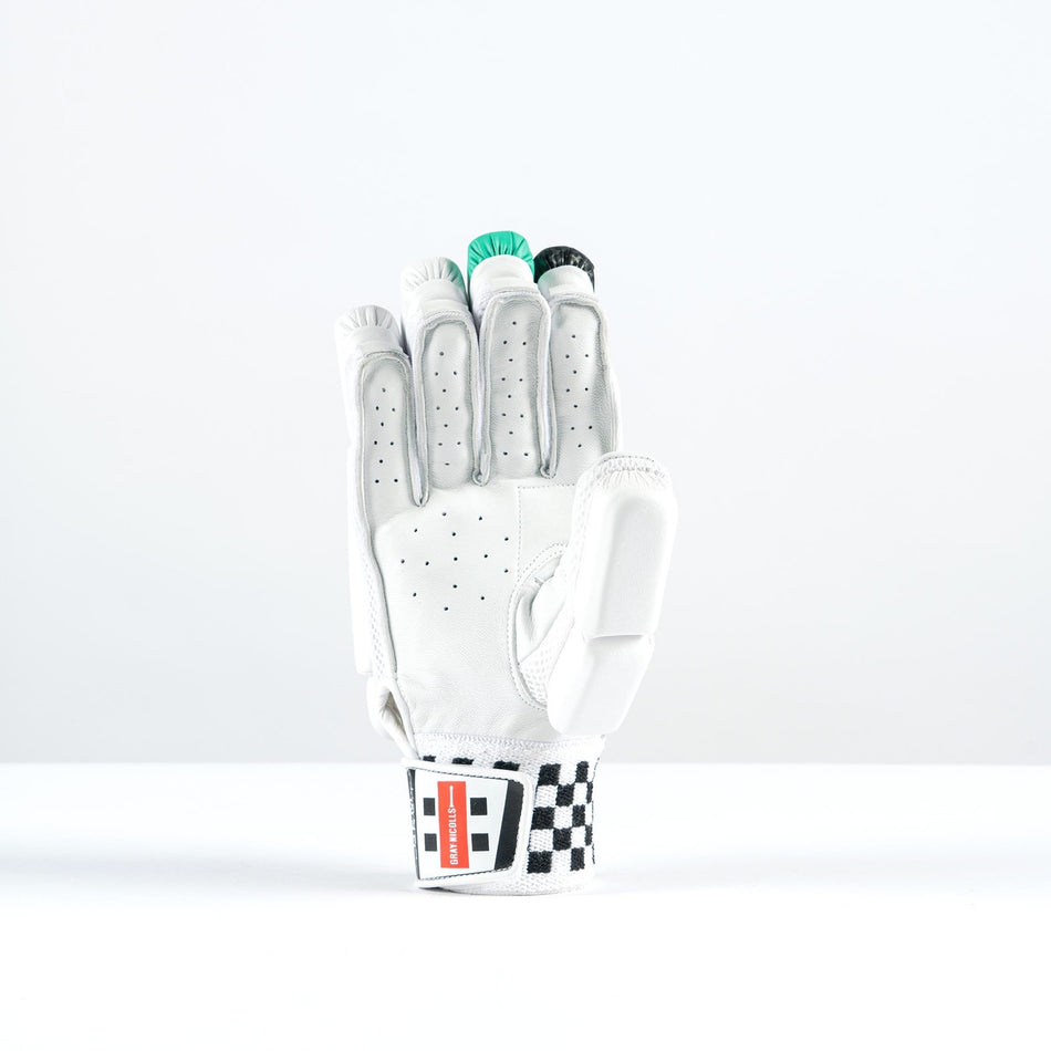 The Gray Nicolls GEM 3.1 400 Batting Gloves 2026, by Gray Nicolls, features high-density foam padding and a black-and-white checkered wristband. The glove stands upright, holding green poker chips against a plain white background.